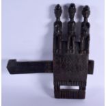 AN EARLY 20TH CENTURY AFRICAN DOGON TRIPLE FIGURE DOOR LOCK. 45 cm x 40 cm.