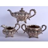 AN EARLY VICTORIAN THREE PIECE SILVER TEASET decorated with foliage and shells. London 1834. 1450 gr