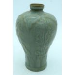 A Chinese Celadon Mei ping vase decorated with foliage in relief . 21cm.