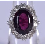A FINE 18CT GOLD DIAMOND AND GARNET RING C1984 the diamond approx 1.62 cts and the garnet 10.9 cts.
