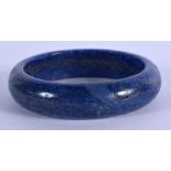 A CHINESE LAPIS LAZULI CARVED BANGLE 20th Century. 6.5 cm high.