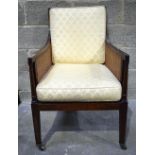 A Bergere chair with cushions 62 x 58 x 96 cm .