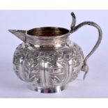 AN ANTIQUE INDIAN SILVER CREAM JUG. 101 grams. 7.5 cm x 10 cm.