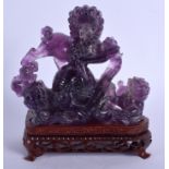 AN EARLY 20TH CENTURY CHINESE CARVED AMETHYST FIGURE OF A BUDDHISTIC LIONS Late Qing/Republic. Ameth