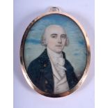 A GEORGE III GOLD MOUNTED PAINTED IVORY PORTRAIT MINIATURE 4.5 cm x 6 cm.