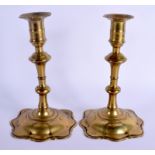 A PAIR OF EARLY 18TH CENTURY BRASS CANDLESTICKS upon splayed feet. 20.5 cm high.