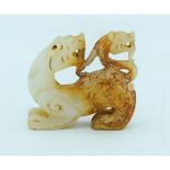 A carved Mutton jade figure of a lion 6 x 5cm .