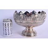 A 19TH CENTURY INDIAN SILVER EMBOSSED BOWL decorated with elephants and landscapes. 568 grams. 20 cm