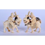 A PAIR OF 19TH CENTURY CHINESE CARVED CANTON IVORY LIONS modelled with attendants. 8.5 cm x 6.5 cm.