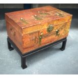AN EARLY 20TH CENTURY CHINESE LACQUERED TRUNK ON STAND painted with figures within landscapes. 60 cm