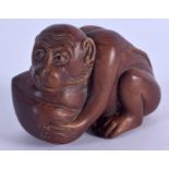 A JAPANESE CARVED BOXWOOD FIGURE OF A MONKEY OKIMONO. 7 cm x 4.5 cm.