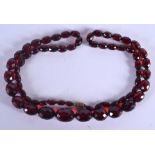 A CHERRY AMBER TYPE NECKLACE. 56 grams. 80 cm long.