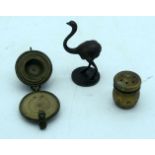 A small bronze set of graduated weights together with two other bronze items. 7cm (3)