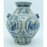 A Chinese Crackle glaze vase with lions head handles decorated with figures and foliage 27cm