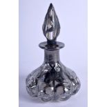 AN ART NOUVEAU SILVER OVERLAID GLASS BOTTLE AND STOPPER. 168 grams. 11 cm high.