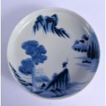 AN 18TH CENTURY JAPANESE EDO PERIOD BLUE AND WHITE CIRCULAR DISH painted with landscapes. 23 cm diam
