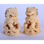 A PAIR OF EARLY 20TH CENTURY CHINESE CARVED IVORY BUDDHISTIC LIONS Qing. 6 cm x 4 cm.