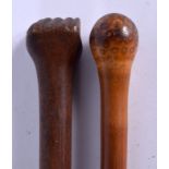 A 19TH CENTURY CARVED JAPANESE MEIJI PERIOD BAMBOO WALKING CANE together with a fist walking cane. 8