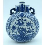 A Chinese blue and white Moon flask decorated with foliage 27 x 21cm.