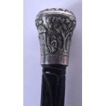 A 19TH CENTURY INDIAN SILVER MOUNTED HARDWOOD WALKING CANE decorated with figures and landscapes. 85