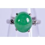 A 14CT GOLD DIAMOND AND JADEITE RING. 6 grams. I/J.
