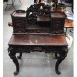 A 19TH CENTURY JAPANESE MEIJI PERIOD CARVED AND LACQUERED DESK decorated with birds and landscapes.