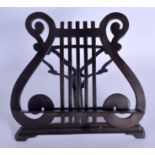 A 1930S BRONZE TABLE TOP MUSIC STAND formed with musical notes. 27 cm x 27 cm.