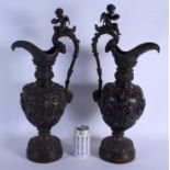 A LARGE PAIR OF 19TH CENTURY FRENCH BRONZE GRAND TOUR PEDESTAL EWERS decorated with figures and acan