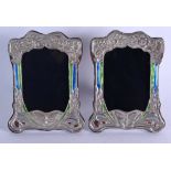 A PAIR OF SILVER AND ENAMEL ART NOUVEAU TYPE PHOTOGRAPH FRAMES. 20 cm x 14 cm.