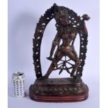 A LARGE EARLY 20TH CENTURY INDO TIBETAN NEPALESE BRONZE BUDDHA modelled in front of a flaming surrou