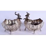 A PAIR OF EARLY 20TH CENTURY SILVER CHERUB BOWLS formed as open flowers. 640 grams. 13 cm x 15 cm.