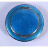 AN ART DECO SILVER AND ENAMEL COMPACT. 62 grams. 5.5 cm wide.