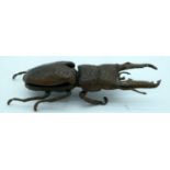 A Japanese bronze figure of a stag beetle 14 cm.