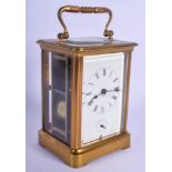 AN ANTIQUE FRENCH BRASS CARRIAGE CLOCK. 16 cm high inc handle.