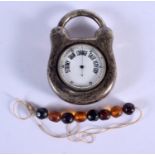 AN ANTIQUE SILVER BAROMETER PADLOCK and amber beads. Padlock 272 grams overall. Largest 10.5 cm x 7
