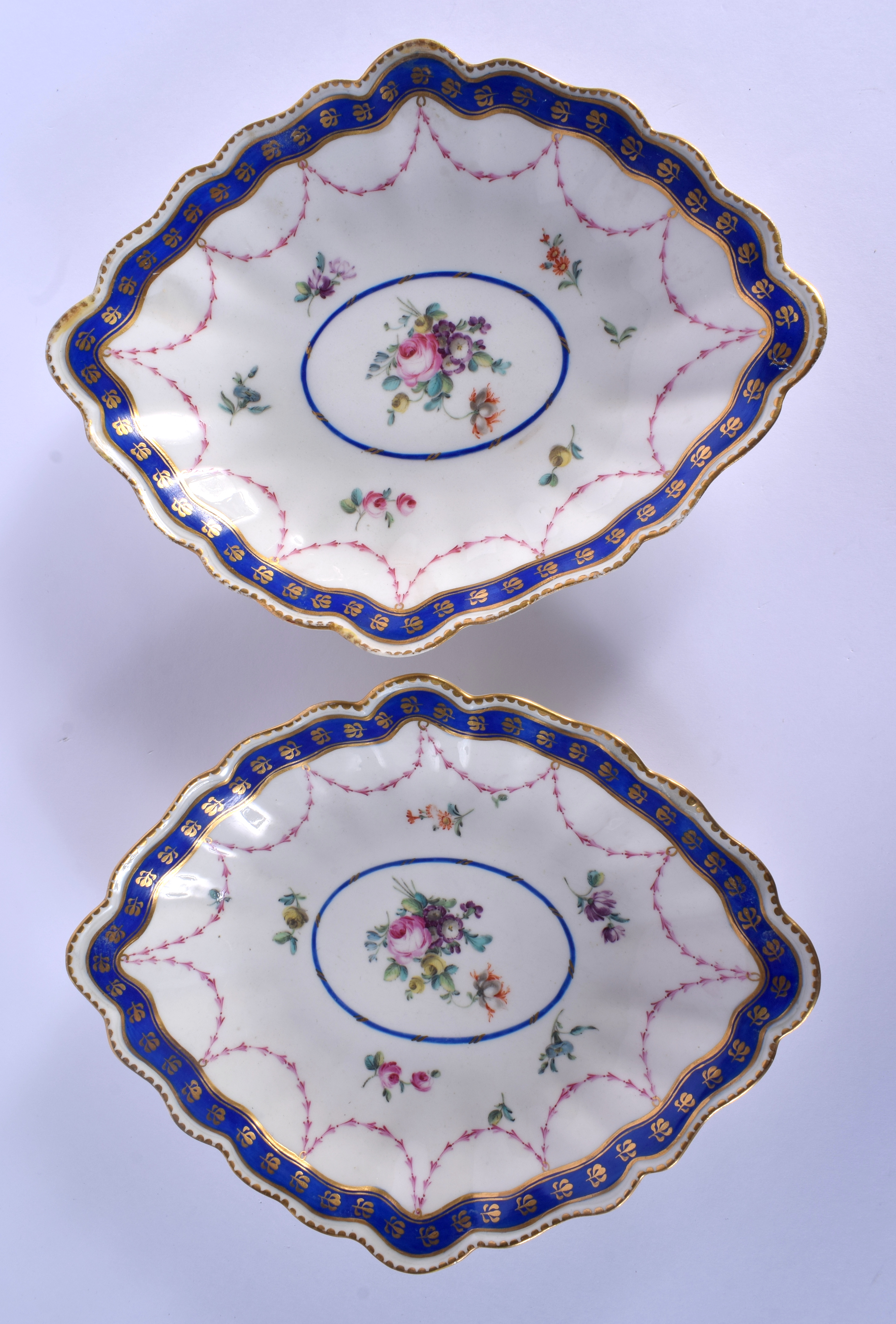 A PAIR OF LATE 18TH CENTURY CHELSEA DERBY PORCELAIN DISHES painted with roses under a trailing puce