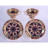 Royal Crown Derby imari pattern 1128 two pedestal cups and saucers. Cup 5.5cm high, Saucer 14cm wid