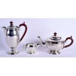 AN ART DECO SILVER THREE PIECE COFFEE SET. Birmingham 1930. 1050 grams. Largest 22 cm high. (3)