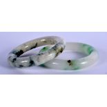 TWO CHINESE JADEITE BANGLES 20th Century. 7 cm diameter. (2)