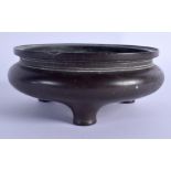 AN 18TH CENTURY CHINESE CIRCULAR BRONZE CENSER Qing, bearing Xuande marks to base. 895 grams. 12.5 c