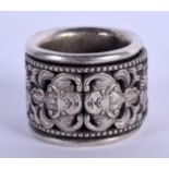 A CHINESE WHITE METAL ARCHERS RING. 2.75 cm wide.