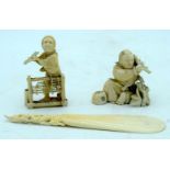 Two Japanese Ivory Okimono , a seated male holding a fan, a standing woman and a carved shoe horn 17