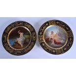 TWO EARLY 20TH CENTURY VIENNA PORCELAIN PLATES painted with classical scenes within a rich blue bord