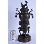 A 19TH CENTURY JAPANESE MEIJI PERIOD BRONZE CENSER AND COVER decorated with figures. 44 cm x 16 cm.