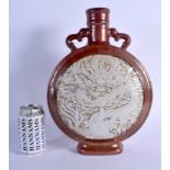 A LARGE CHINESE TWIN HANDLED COPPER GLAZED PORCELAIN MOON FLASK 20th Century, carved with an unglaze