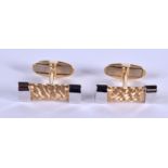 A PAIR OF TWO TONE 14CT GOLD CUFFLINKS. 10.8 grams.