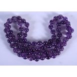 A CHINESE AMETHYST NECKLACE 20th Century. 66 cm long.