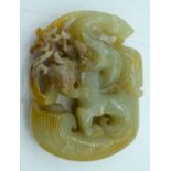 A carved Jade pendant 5.5.x 4 cm.