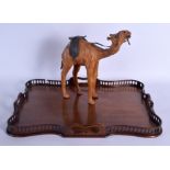 A 1920S CARVED MAHOGANY CHIPPENDALE SERVING TRAY together with a leather camel. Largest 55 cm x 37 c
