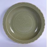 A LARGE CHINESE QING DYNASTY CELADON BARBED STONEWARE DISH Ming style, incised with foliage and vine
